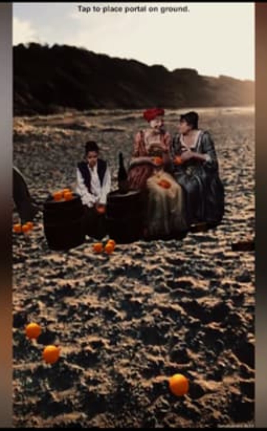 Mixed reality geolocated storyquest oranges and actors - judy dench? on a beach