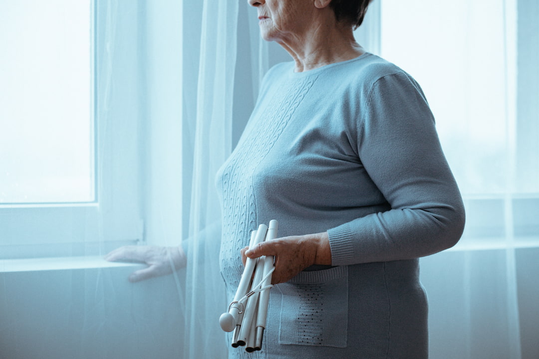 AR accessibility for sight loss - isolation, woman by window